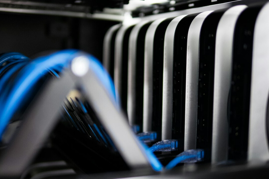 Rows of illuminated server racks in a modern data center